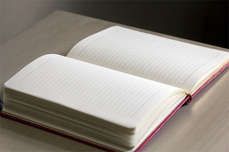 Blank opened journal on a desk