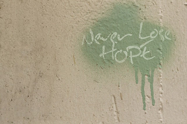 "Never Lose Hope" paint splattered on a wall